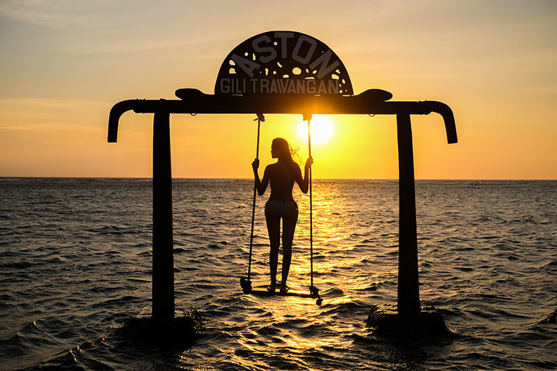 Silhouette of Beautifull Gate with girls swing Gili Trawangan